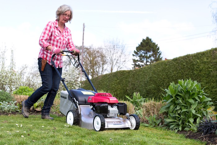 Mowing the lawn along the edge. Sarah Cuttle Mowing the lawn along the edge. Sarah Cuttle