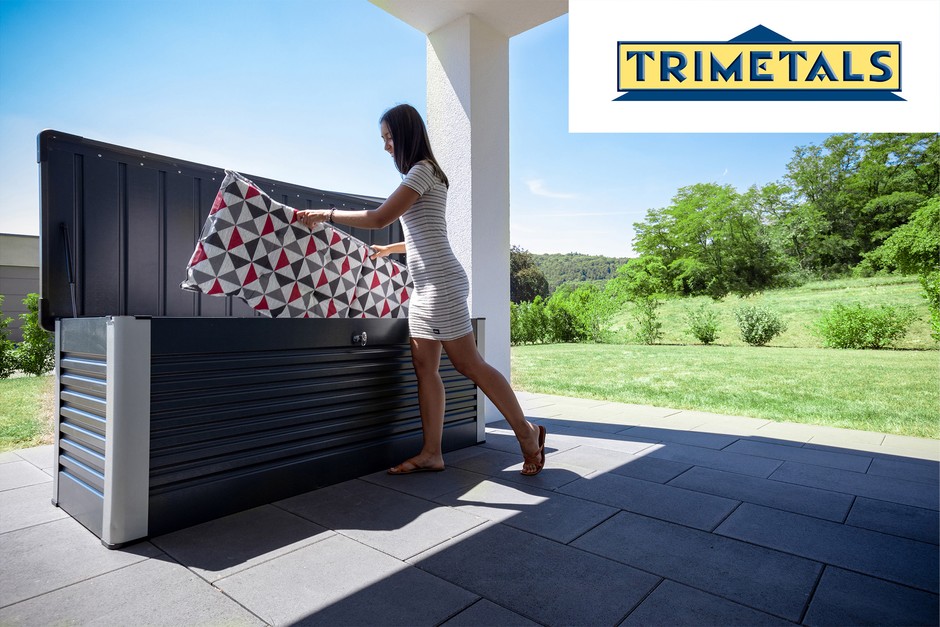 Woman placing outside cushions in Trimetals Patio Box
